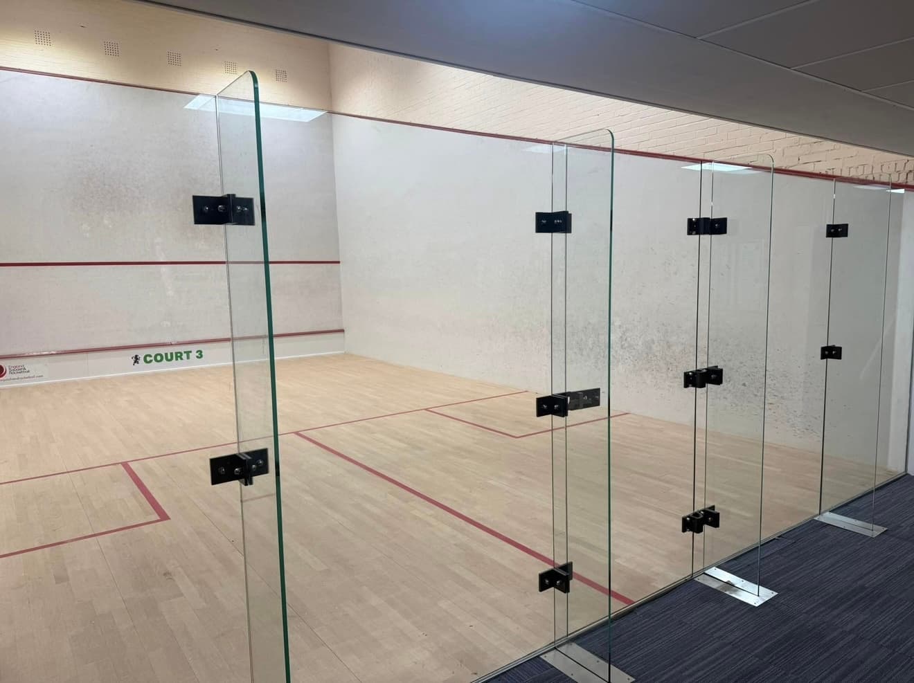New toughened glass back wall fitted to the squash court
