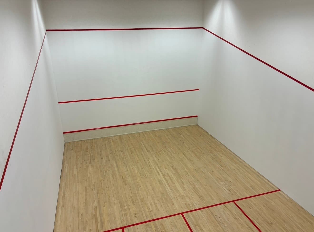 Squash court walls freshly repainted after refurbishment