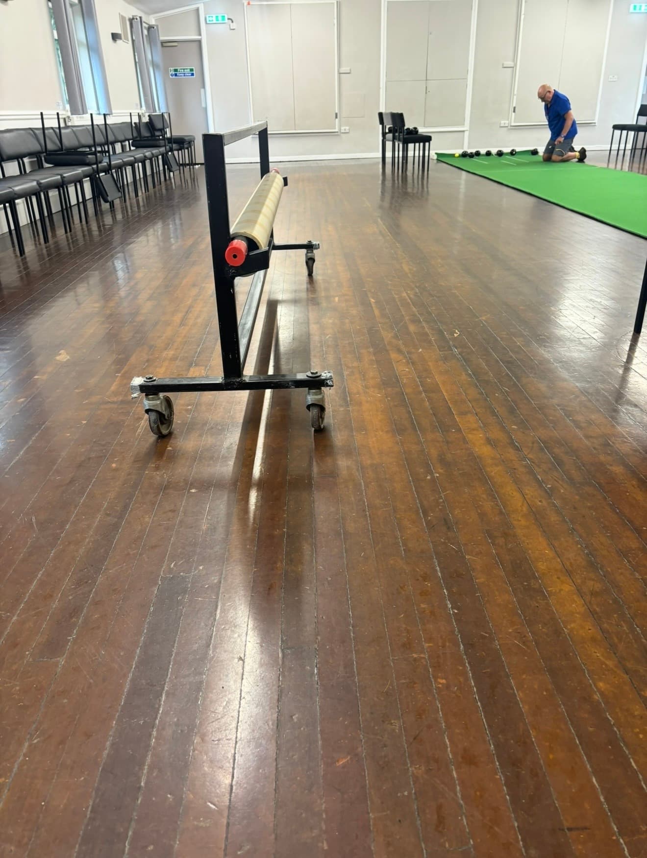 Worn, dull squash court floor before refurbishment